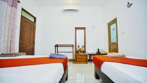 Postel nebo postele na pokoji v ubytování SMW Lodge Sigiriya