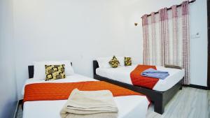 Voodi või voodid majutusasutuse SMW Lodge Sigiriya toas