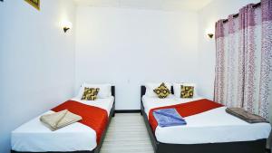 Voodi või voodid majutusasutuse SMW Lodge Sigiriya toas