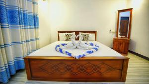 Voodi või voodid majutusasutuse SMW Lodge Sigiriya toas