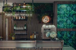 a bar with bottles of alcohol on a wall at Hotel Marconi in Fiuggi