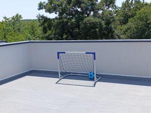 a soccer ball is sitting in front of a goal at Villa Tempest with Private Pool and Jacuzzi in Slivnica