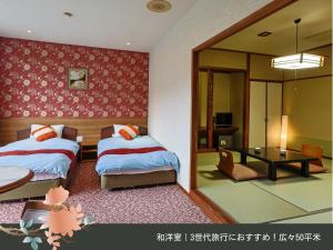 Rúm í herbergi á Hinotani Onsen Misugi Resort