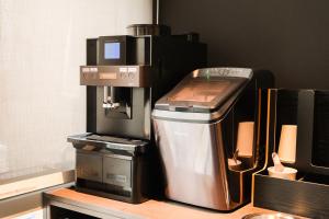 a coffee maker sitting on top of a counter at GOYOO INN & cabins in Seoul