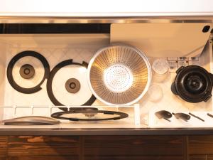 a kitchen counter with a stove and various kitchen utensils at 松江日和 by HIYORISTAY in Matsue