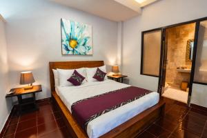 Voodi või voodid majutusasutuse Mumbul Ubud toas