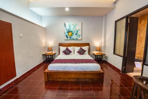 Voodi või voodid majutusasutuse Mumbul Ubud toas