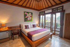Voodi või voodid majutusasutuse Mumbul Ubud toas