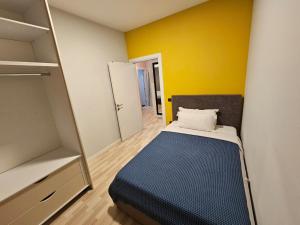 Ένα ή περισσότερα κρεβάτια σε δωμάτιο στο My Apartments - 2
