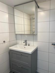 a bathroom with a sink and a mirror at COZY ROOM - between Malmö & Lund in Lund