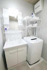 Koupelna v ubytování フォルモント寺田町 203 + 57 fotografií