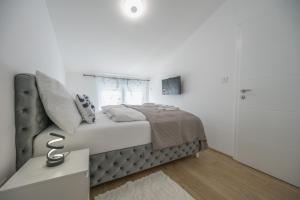 Postel nebo postele na pokoji v ubytování Apartman TRI KRALJA 2