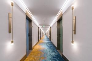 Imagine din galeria proprietății Manxin Hotel Guangzhou Baiyun Airport Branch în Guangzhou +63 fotografii