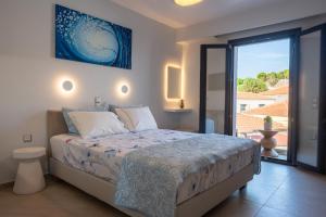 Posteľ alebo postele v izbe v ubytovaní Eressian Lodgings - Skala Eressos