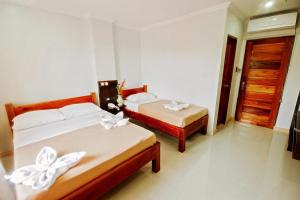 Katil atau katil-katil dalam bilik di Hotel Lapira Vigan