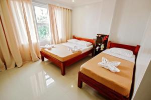 Katil atau katil-katil dalam bilik di Hotel Lapira Vigan