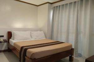 Katil atau katil-katil dalam bilik di Hotel Lapira Vigan