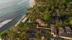 an aerial view of a resort next to the ocean at Qunci Villas Resort in Senggigi