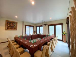 a large conference room with a long table and chairs at Qunci Villas Resort in Senggigi +37 photos