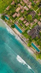 an aerial view of a beach with houses and the water at Qunci Villas Resort in Senggigi