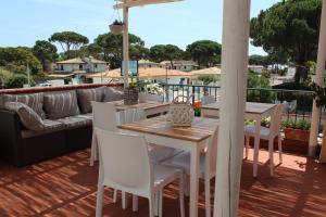 a patio with a table and chairs and a couch at CircEea Beach B&B in San Felice Circeo