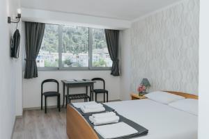 Postel nebo postele na pokoji v ubytování Hotel Tolero