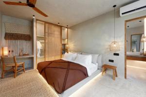 Ένα ή περισσότερα κρεβάτια σε δωμάτιο στο Garden Villas Ubud By BREIG +55 φωτογραφίες