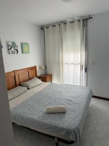 Ένα ή περισσότερα κρεβάτια σε δωμάτιο στο Riviera Ático +61 φωτογραφίες