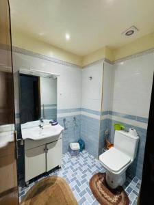 a bathroom with a toilet and a sink at Sunrise Private Apartment in Marrakech