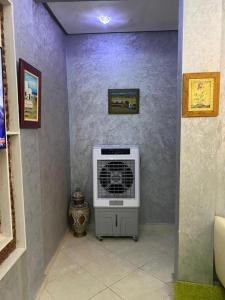 a room with a air conditioner in a wall at Sunrise Private Apartment in Marrakech +6 photos