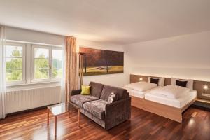 Postel nebo postele na pokoji v ubytování Golfhotel Bodensee by Michael Ritter