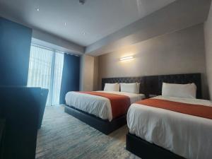 Postel nebo postele na pokoji v ubytování Hotel MTbilisi