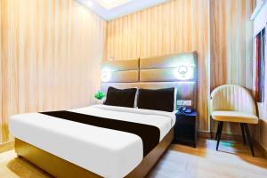 Ένα ή περισσότερα κρεβάτια σε δωμάτιο στο Collection O Prayagraj Rambag Railway Station