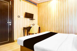 Ένα ή περισσότερα κρεβάτια σε δωμάτιο στο Collection O Prayagraj Rambag Railway Station +20 φωτογραφίες