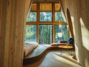 a room with a bed and a large window at SANU 2nd Home 山中湖1st in Yamanakako