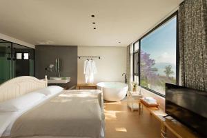Dali Blue House Sea View B&B客房内的一张或多张床位