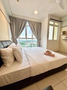 a bedroom with a large bed with a window at KSL Modern Studio 1-2Pax #Daya#Austin#Ikea#Aeon in Johor Bahru