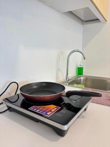 a frying pan sitting on top of a stove at KSL Modern Studio 1-2Pax #Daya#Austin#Ikea#Aeon in Johor Bahru