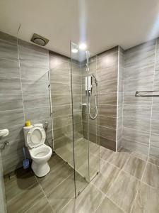 a bathroom with a toilet and a glass shower at KSL Modern Studio 1-2Pax #Daya#Austin#Ikea#Aeon in Johor Bahru