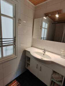 a bathroom with a sink and a mirror at Väentupa in Kaarina +25 photos