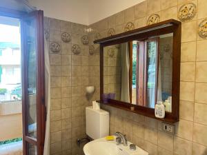 a bathroom with a sink and a mirror at Villino IRMA in Porto San Giorgio +72 photos