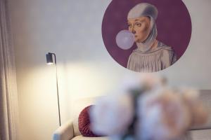 a reflection of a painting of a nun in a mirror at LeonArt Living 21 in Graz