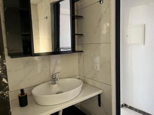 a bathroom with a white sink and a mirror at Countryside Retreat 3 in Agios Arsenios +31 photos