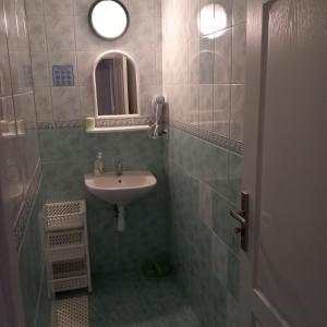 a bathroom with a sink and a mirror at Willa Koral in Władysławowo +59 photos