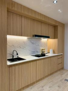 a kitchen with a sink and a counter top at Luana Hatyai house in Hat Yai