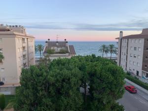 a view of the ocean from a building at Penthouse w/ sea view, pool & beach in Calafell