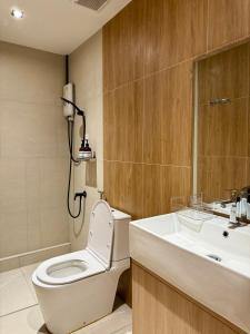 a bathroom with a toilet and a sink at Luana Hatyai house in Hat Yai +40 photos