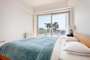 a bedroom with a large bed with a view of the ocean at NOA - Sungu 1 in Istanbul