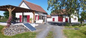 a house with a ramp in front of it at Maison cosy au calme à 15 min du Pal - l'Ecole Buissonnière in Saligny-sur-Roudon