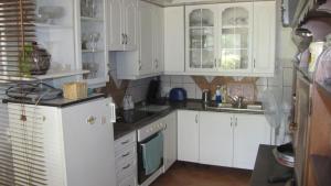 Kuchyňa alebo kuchynka v ubytovaní Alsóhegyi Apartmanok